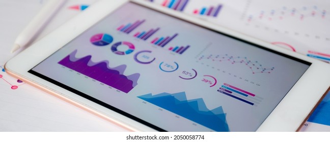 Report Graph And Chart Of Investment With Finance On Tablet Computer On Desk, Datum Of Stock And Growth, Planning And Statistic With Economic, No People, Digital Marketing, Business Concept.