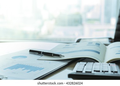 The report summarizes the results of business operations, pen, calculator on desk of investor.
 - Shutterstock ID 432826024