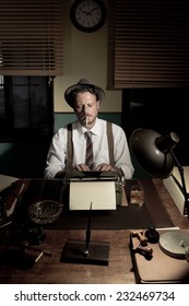 Reporter Working Late At Night And Smoking In His Office, 1950s Film Noir Style.