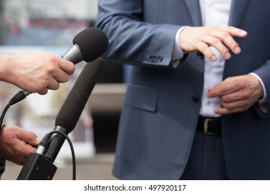 Reporters making interview with businessperson, politician or spokesman. News conference. - Shutterstock ID 497920117