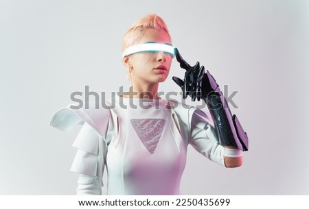 Representation of a bionic super human with advanced technology parts as vr visors and gadgets playing in a mixed reality training room. Futuristic cyberpunk evolution of human mankind and AI