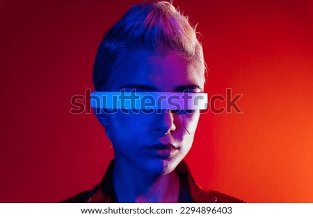 Representation of a bionic super human with advanced technology parts as vr visors and gadgets playing in a mixed reality training room. Futuristic cyberpunk evolution of human mankind and AI