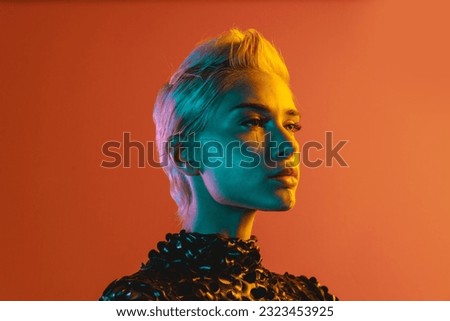 Representation of a bionic super human with advanced technology parts as vr visors and gadgets playing in a mixed reality training room. Futuristic cyberpunk evolution of human mankind and AI