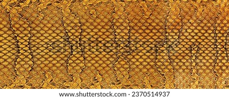 Reptile leather - snake skin texture, as background. Brown snake pattern imitation.