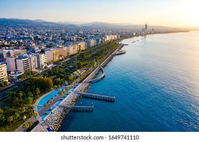 Republic of Cyprus. Limassol promenade from a height. Panorama of the Mediterranean coast at sunset. Sea promenade of Limassol. Molos. Promenade by the Mediterranean sea. Holidays in Cyprus.