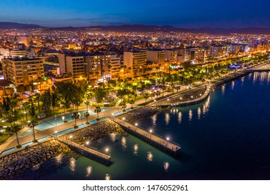 Republic of Cyprus. Night view of Limassol. Lit at night the streets of Limassol. Top view of Cyprus. Holidays in Cyprus. Piers and quay. A pedestrian pier leads to the sea.