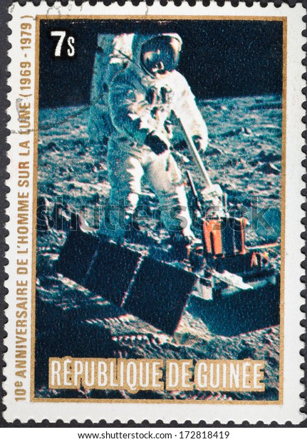 REPUBLIC OF GUINEA - CIRCA\
1979: A postage stamp printed in the Republic of Guinea shows the\
Apollo 11 Moon Landing and Armstrong first step on The Moon\
surface, circa 1979