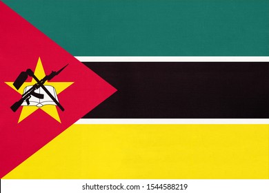Republic of Mozambique national fabric flag, textile background. Symbol of international world African country. State mozambican official sign.