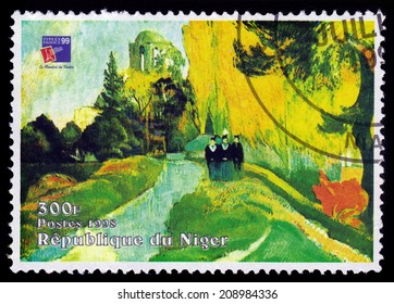 REPUBLIC NIGER - CIRCA 1998: A stamp printed in Niger shows painting by Paul Gauguin, Les Alyscamps (The Three Graces at the Temple of Venus ), series, circa 1998