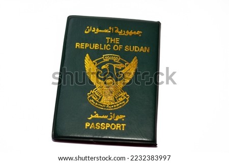 The Republic of Sudan passport with a gilded falcon in the center of the front cover, selective focus of Sudanese passport identity of North Sudan used for having visa stamps during traveling