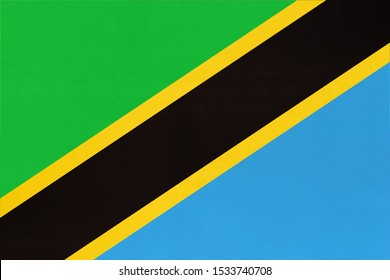 Republic Tanzania national fabric flag textile background. Symbol of international world african country. State official Tanzanian sign.