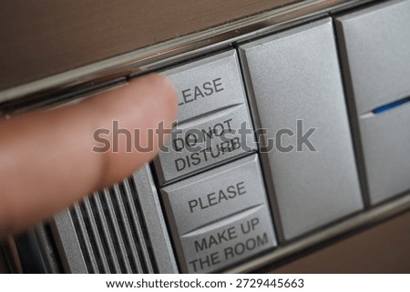 Request button being pressed in a hotel room