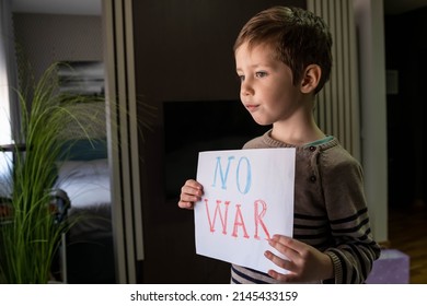 Request For Help To World Community. Caring For Each Other. Military Protest. Child With Message Stop War. Child Raises A Banner With The Inscription No War. Kids Is Protesting. Activism Concept.