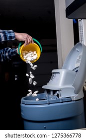 As required by maintenance log salt is added to a water softener in a garage