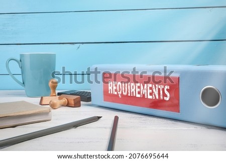 REQUIREMENTS, Business concept. Document folder on office desk.