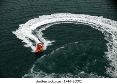 Rescue Boat Speeding And Making A Turn In The Ocean