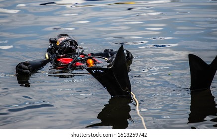 Rescue Diver On A Line Floating On His Back 