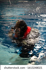 Rescue Diver Suited Up In A Swimming Pool