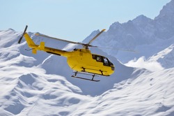 A Rescue Helicopter In Snow Covered Mountains Used To Transport Injured Sports People Rapidly From Inaccessible Mountainous Terrain To Medical Facilities, Saving Many Lives