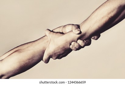 Rescue, Helping Gesture Or Hands. Strong Hold. Close-up. Two Hands, Helping Hand Of A Friend. Handshake, Arms, Friendship. Friendly Handshake, Friends Greeting, Teamwork, Friendship. 