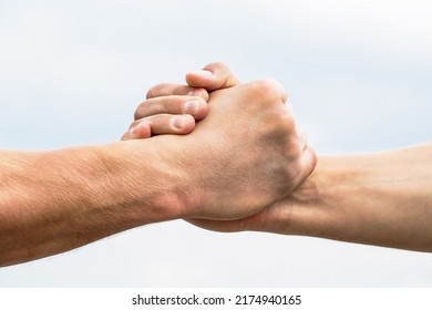 Rescue, Helping Gesture Or Hands. Two Hands, Helping Arm Of A Friend, Teamwork. Helping Hand Outstretched, Isolated Arm, Salvation. Friendly Handshake, Friends Greeting, Teamwork, Friendship.