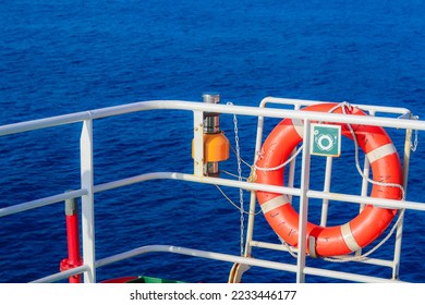 rescue lifebuoy which is installed on supply vessel rail, stand by for man overboard. Emergency equipment for transportation. Life saving appliance on the ship. Lifebouy with line