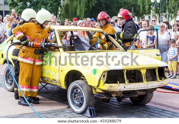 Rescue\
simulation of accident.Rescue simulation of accident. Grodno,\
Belarus - July 25 2016: Simulation of road accidents, joint\
intervention between firefighters and\
rescuers.