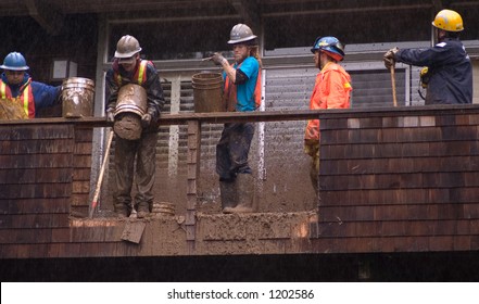 Rescue Workers Trying To Save Man Buried In Mud Slide Behind House, Mill Valley, California