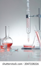 Research and develop product concept with scientific glassware. Concept laboratory tests and research natural extract making cosmetic