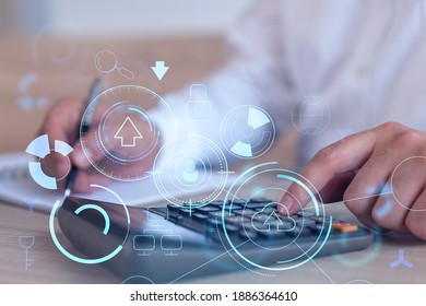 A Research And Development Specialist Computing The Data To Create A New Approach To Develop High Tech Business. Technological Icons Over The Desk With Calculator.