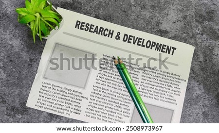 Research and Development text in headline isolated on white background. Newspaper concept