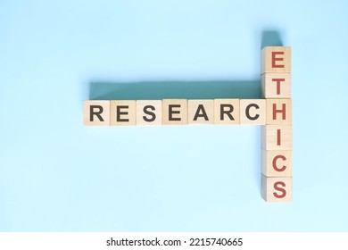 Research Ethics Concept. Crossword Puzzle Flat Lay Typography In Blue Background
