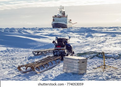 Research icebreaker and snowmobile with sledges while setting up an ice camp - Powered by Shutterstock