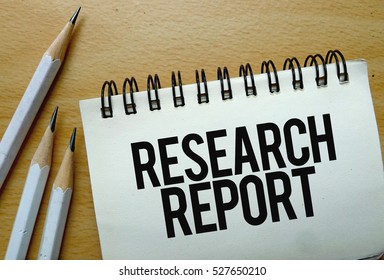 Research Report Text Written On A Notebook With Pencils