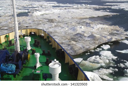 Research Vessel In Icy Arctic Sea On A Sunny Day