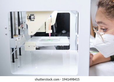 Researcher Adjusting A 3D Bioprinter To 3D Print Cells Onto An Electrode. Biomaterials, Tissue Engineering Concepts.