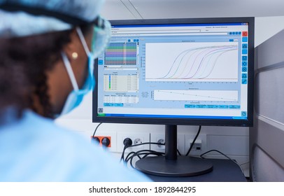 Researcher Analyzing Data On The Computer In The Laboratory At Covid-19 Vaccine Research