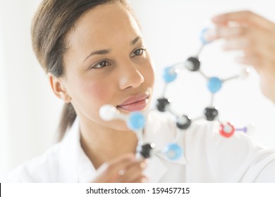 Researcher examining molecular structure in laboratory - Powered by Shutterstock