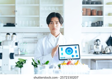 A researcher explaining while showing the tablet screen