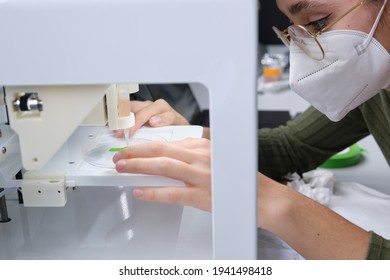 Researcher Getting 3D Bioprinter Ready To 3D Print Cells Onto An Electrode. Biomaterials, Tissue Engineering Concepts.