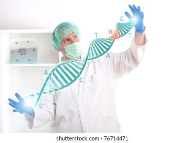 Researcher Or A Medic Holding Up A DNA Strand. This Could Be Also Futuristic Doctor Using Genetic Engineering Techniques Known As Recombinant DNA Technology.