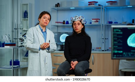 Researcher And Patient With Eeg Headset Looking At Virtual Display With Touchscreen, Virtual Reality Using Medical Inovation In Neurological Research Lab. Scientists Working With Healthcare Simulator