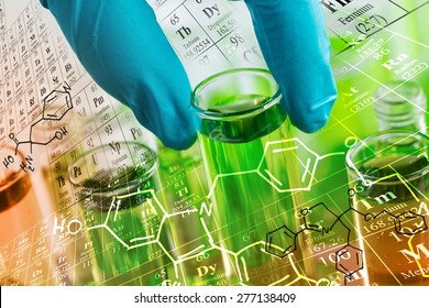 Researcher 's gloved hand holding the test tubes at laboratory, with chemical equations and periodic table background.