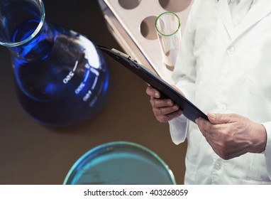researcher test chemistry at science lab background - Shutterstock ID 403268059
