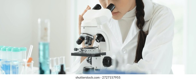 researcher using microscope analyse cell in medical lab.