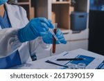 Researcher using a professional microscope