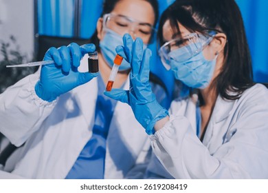 Researcher using a professional microscope