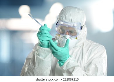 Researcher Wearing A Hazmat Suit Working In The Lab