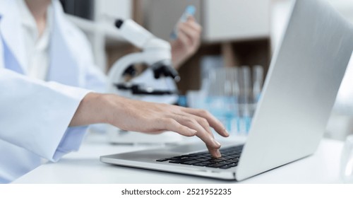 Researchers Conducting Experiments and Analyzing Substances in a Modern Laboratory Setting - Powered by Shutterstock