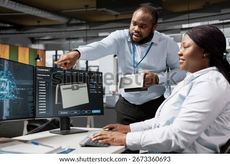 Researchers in office using artificial intelligence to build solar powered prototype to meet sustainability goals. Colleagues use AI deep learning to prototype solar cells gadget with lower costs